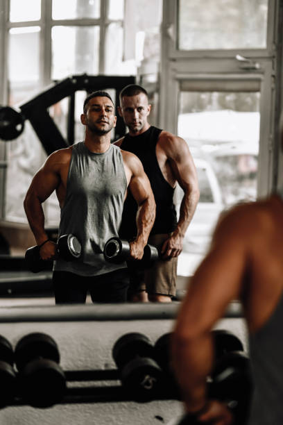 istock Two Bodybuilders Workout Out Together In Gym 1708587188