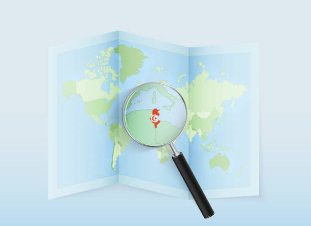 istock A folded world map with a magnifying lens pointing towards Tunisia. Map and flag of Italy in loupe. 1708605729