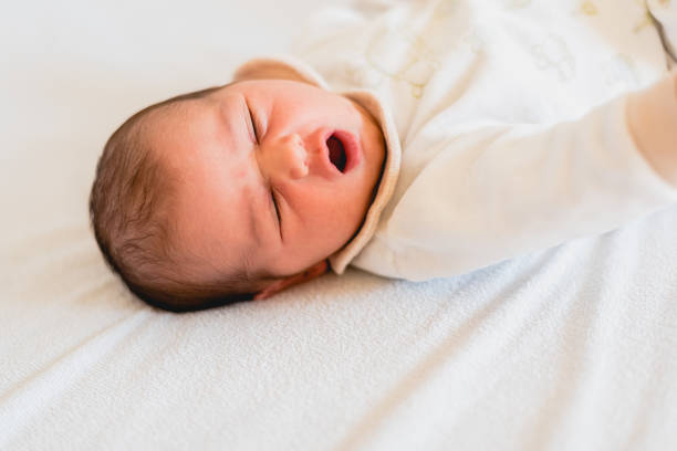 istock Newborn baby yawning. 1708614391