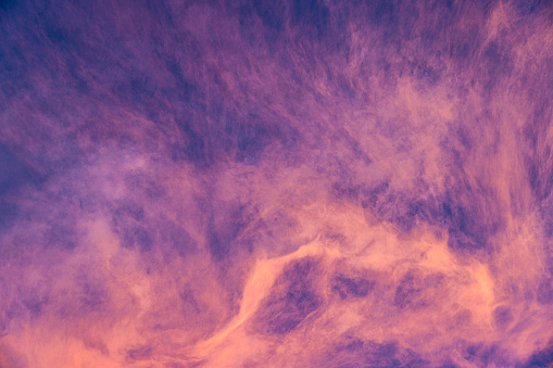 Abstract Pink and Purple Sunrise Clouds in Sky