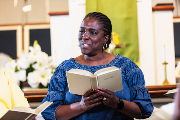 Mature black woman in group bible study