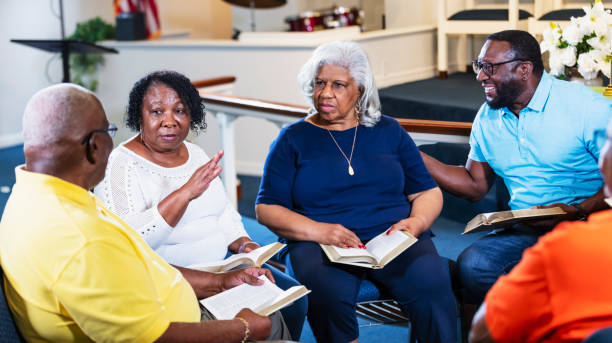 istock Senior men and women in bible study group 1708662105