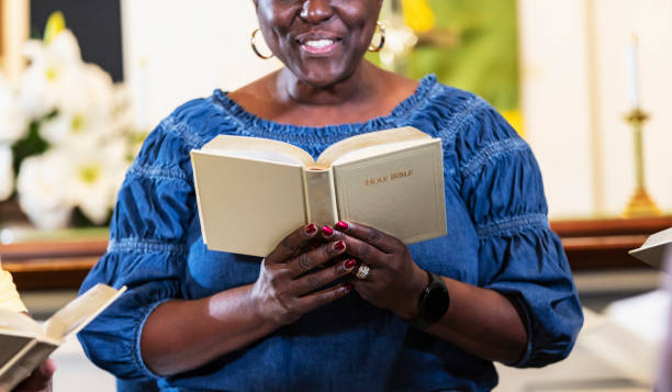 istock Mature black woman in group bible study 1708662108