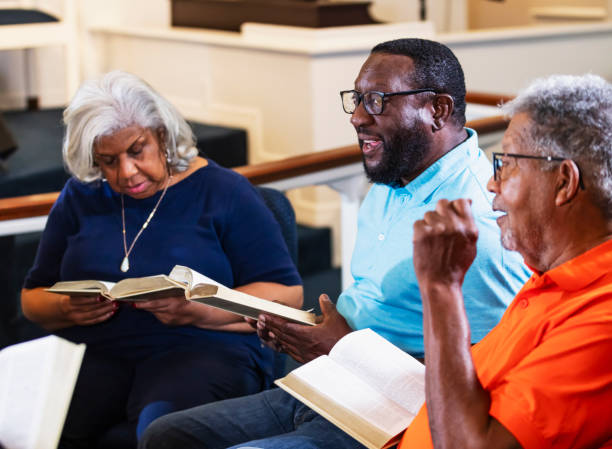 istock Senior African-American man leading bible study group 1708662115