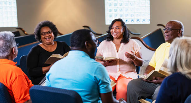istock Black men and women in group bible study 1708662630