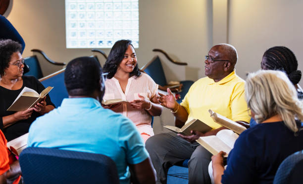 istock Black men and women in group bible study 1708662631