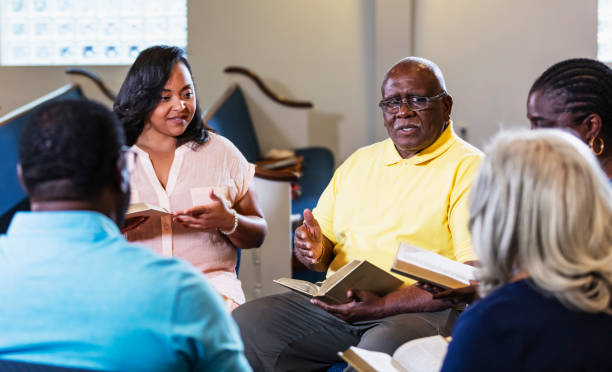 istock Senior African-American man leading bible study group 1708662632