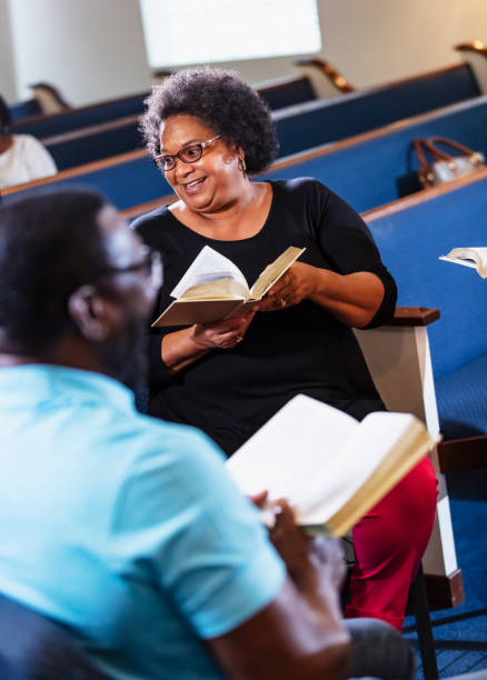 istock Senior black woman in group bible study 1708662641