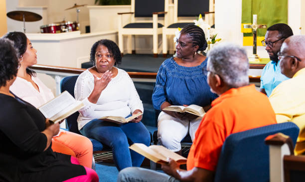 istock Black men and women in group bible study 1708663150