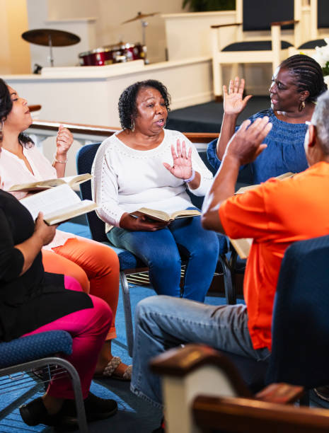 Black men and women in group bible study