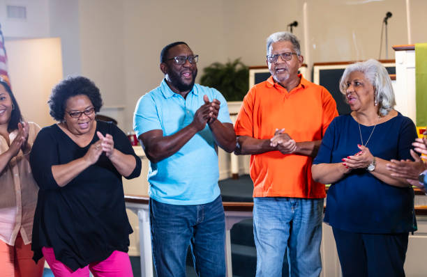 istock Senior black men and women clapping and singing 1708663170