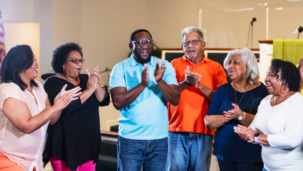 istock Senior black men and women clapping and singing 1708663174