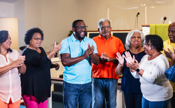 istock Senior black men and women clapping and singing 1708663175
