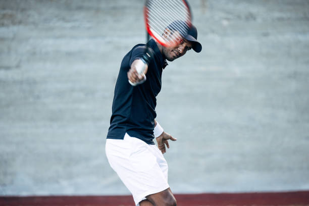 istock Professional tennis player hitting the serve during a match 1708689178