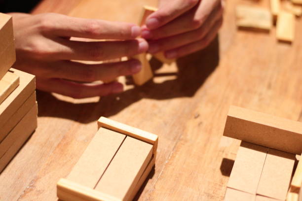 istock Boy Playing with Wooden Pieces 1708695181