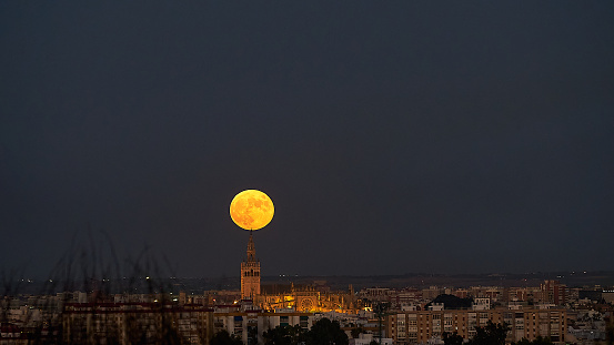 Seville's Giralda Tower Bathed in the Light of the Full Moon