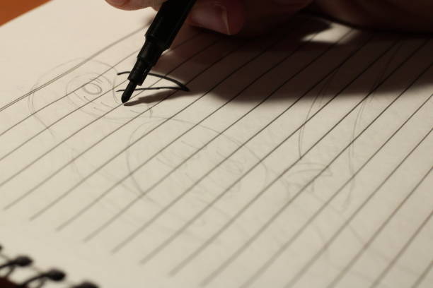 istock Girl Drawing Birds with Colored Pens in her Notebook 1708720660