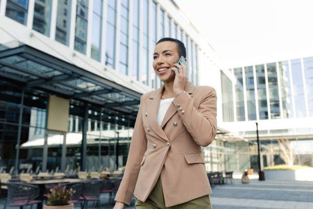 istock Young woman using smartphone on the street 1708794609