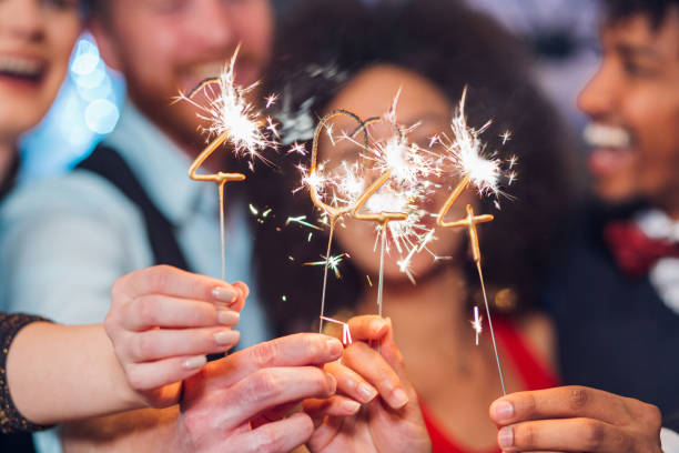 New year's sparklers Joyful young people holding sparklers in a club 2024 30 stock pictures, royalty-free photos & images