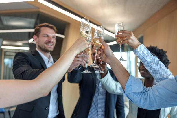 istock Multicultural Young Executive Team Celebrating With Champagne At The Office 1708801285