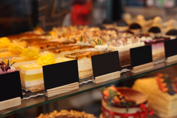 istock Showcase with different tasty desserts in bakery shop, closeup 1708832241