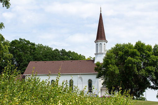 Prior Lake, Minnesota, USA - August 10, 2023: Landscape view of the idyllic Church of St. Catherine, a wooden Catholic parish built in 1896 in rural Scott County.