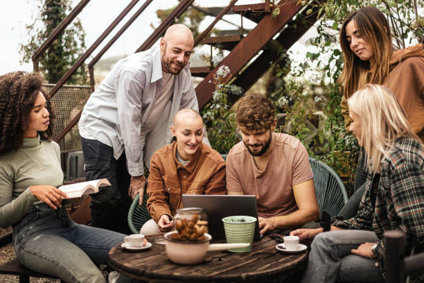 istock six gen z Erasmus students from different countries gathering using laptop on a terrace co-working space, studying and discussing about lessons together 1708896533
