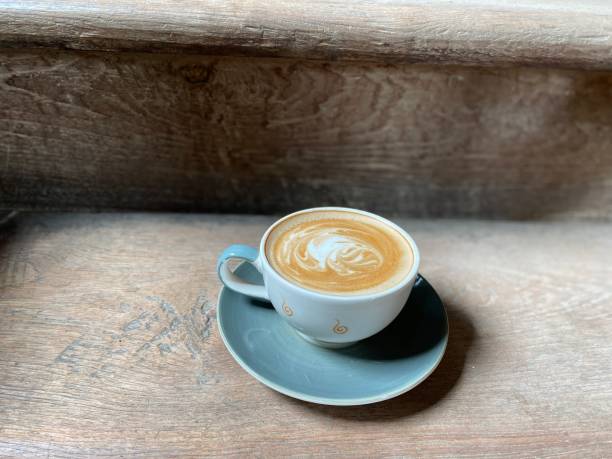 istock a cup of latte art coffee on wooden background 1708932209