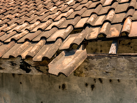 Roof tiles are made from pressed and fired clay and have quite good strength