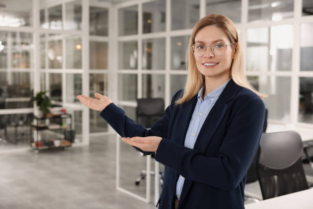istock Happy female real estate agent in office 1708943121