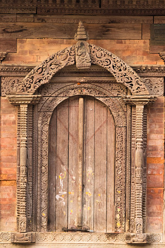 Carved wooden door details of one of the temple located at Hanuman Dhoka, Kathmandu, Nepal