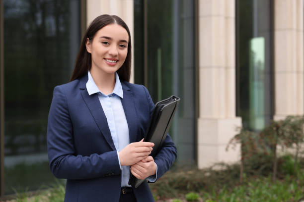 istock Real estate agent with leather portfolio outdoors. Space for text 1708960330