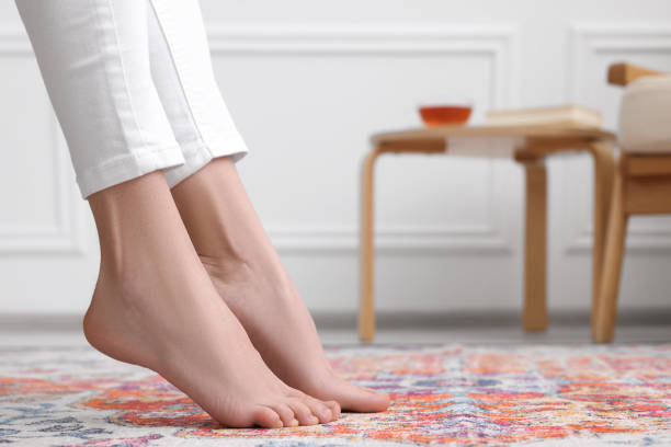 istock Woman on carpet with pattern at home, closeup. Space for text 1708993038
