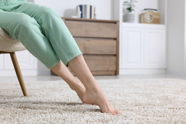 istock Woman on soft light brown carpet at home, closeup. Space for text 1708993812