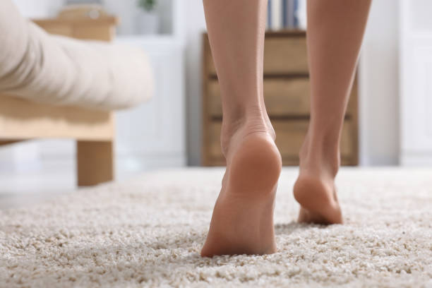 istock Woman walking on soft light brown carpet at home, closeup. Space for text 1708996782