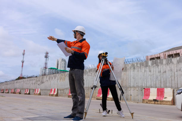 istock Engineer use theodolite equipment surveying construction worker on the road site. 1709047744