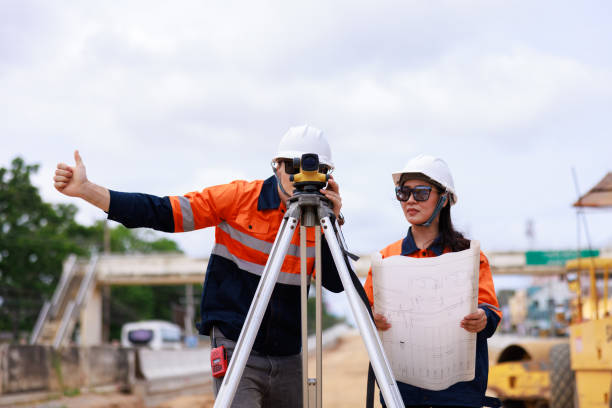 istock Engineer use theodolite equipment for route surveying to build a bridge 1709048282
