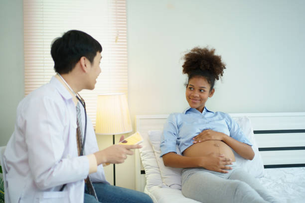 istock Pregnant woman taking with a doctor. 1709116781