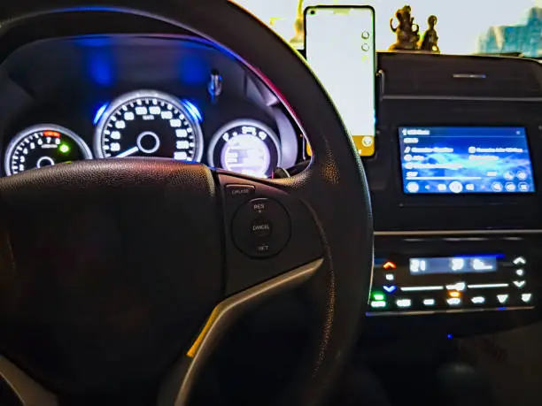 Photo of Honda steering wheel showing car dashboard