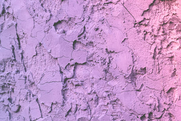 istock old   cracked   pink and purple  concrete  wall texture background 1709157743