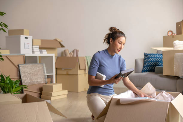 istock Asian woman moving into new apartment 1709181517