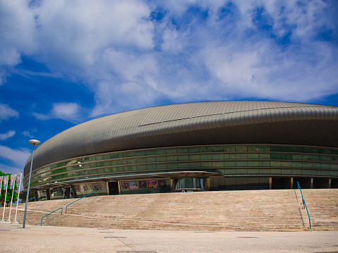 Altice Arena, Lisbon, Portugal - July 04 2019 :  The unique saucer shaped arena is a massive indoor concert and exhibition complex rests on a raised plateau in full view of the hot afternoon sun.