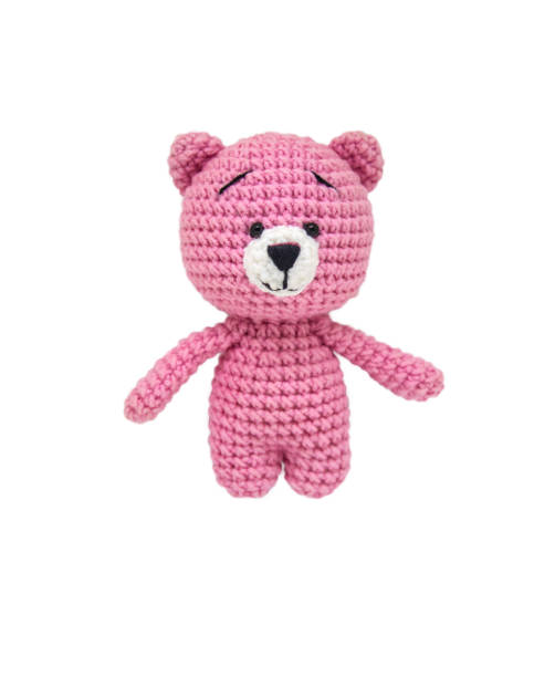 Teddy bear knitted crochet isolate on a white background. Selective focus. Teddy bear knitted crochet isolate on a white background. Selective focus. Baby. pink teddy bear stock pictures, royalty-free photos & images