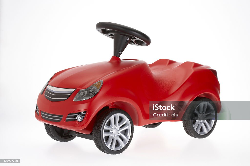Small red toy car side view on white background Kid's car studio shot, isolated on white background Toy Car Stock Photo