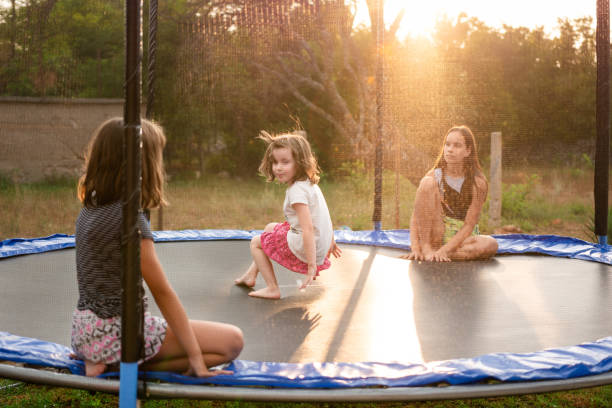 istock Group of children playing in trampoline at summer day 1709289877