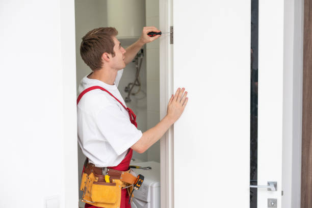 istock Young man fixing the door in house. 1709304962