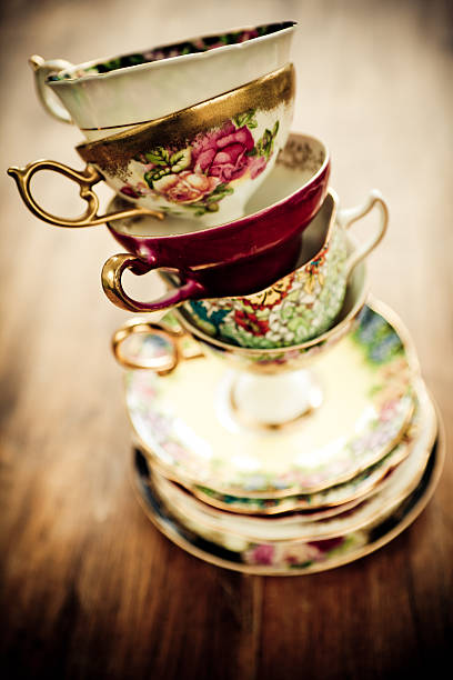 Tea time Stack of a variety of fancy tea cups. tea cup and saucer stock pictures, royalty-free photos & images