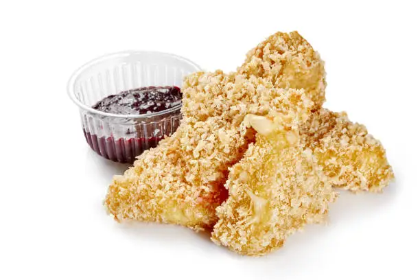 Photo of Crispy breaded fried mozzarella pieces with berry sauce