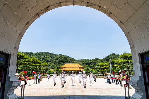 Taipei, Taiwan- July 7, 2023: Tourists to see the ceremonial Military Police Officers changing the guards in the National Revolutionary Martyrs' Shrine, Taipei, Taiwan.