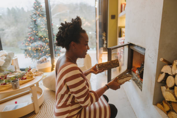 istock Adding wood to the fireplace 1709382260